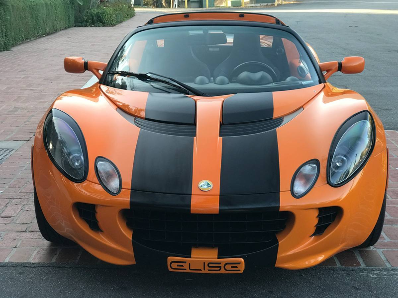 Illustration for article titled For $29,999, Could This Orange And Black 2005 Lotus Elise Have You Ready For Halloween?